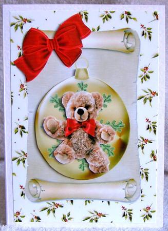 Cute Little Teddy in a Bauble with Big Red Bow by Margaret McCartney