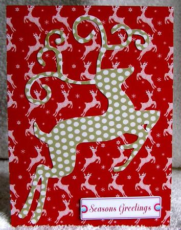 Lace Reindeer on Red Background Paper by Margaret McCartney