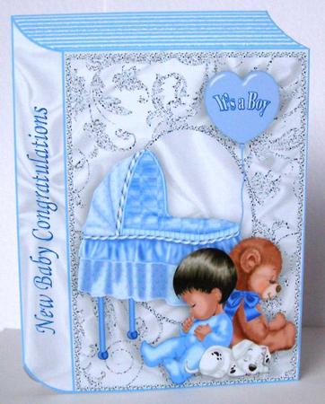 Cute Baby Boy with Teddy on a Folded Book by Margaret McCartney