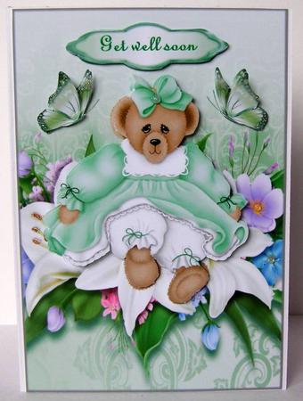 Birthday Bear in Green with Lillies by Margaret McCartney