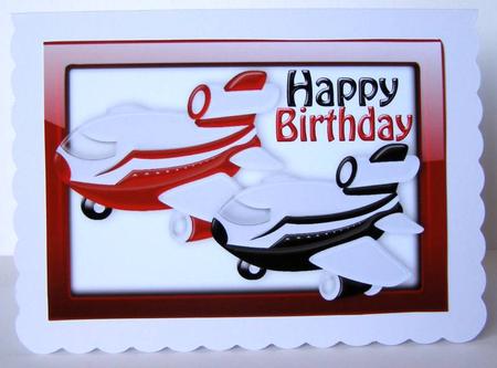 Little Black and Red Aeroplane in Glass Frame A4 by Margaret McCartney