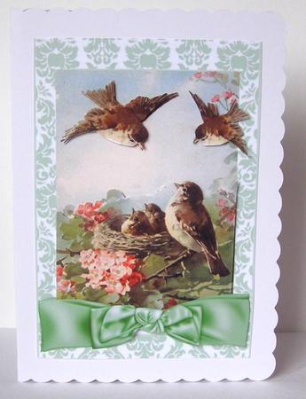 Spring is Here! Birds in a Nest with Bow by Margaret McCartney