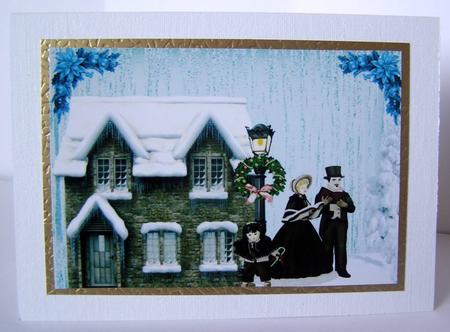 Snow Cottage with Carol Singers A4 Topper by Margaret McCartney