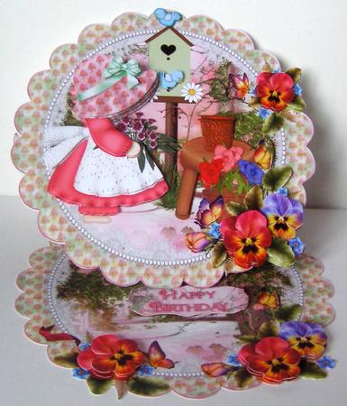 Little Birdhouse Lady Scalloped Round Easel Card by Margaret McCartney