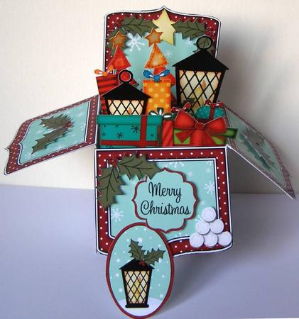 3D Xmas Lantern & Pointsettia Rubber Band Pop Up Box Card by Margaret McCartney
