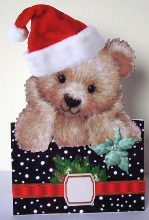 Little Fuzzy Bear in Santa Hat with Bow Over the Edge by Margaret McCartney