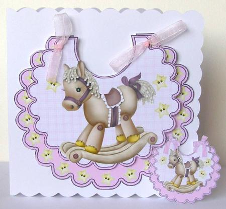 Lovely Rocking Horse with Stars on a Pink Bib by Margaret McCartney