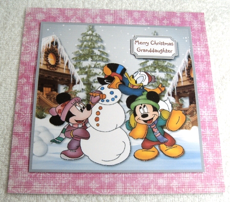 Mickey and friends build a snowman by Margaret Scott