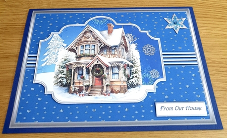 Santas house in the snow A5 by Margaret Scott