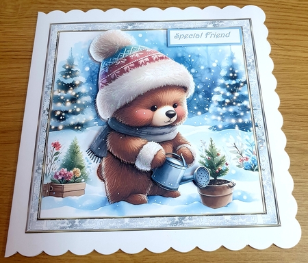 Winter bear watering a Christmas tree 6x6 by Margaret Scott