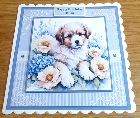 Dog With Blue & Cream Flowers by Margaret Scott