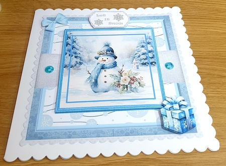 Snowman in Blue by Margaret Scott