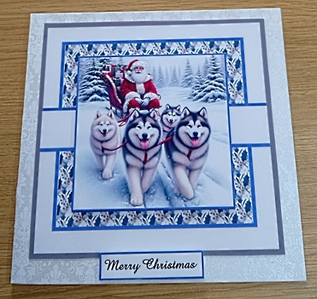santa huskies  by Margaret Scott