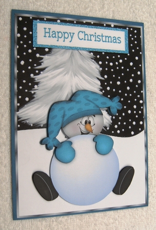 Mr Snowman in Turq, with Christmas Tree by Margaret Scott