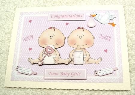 Twin baby girls with rattle, stork, name tags & hearts by Margaret Scott