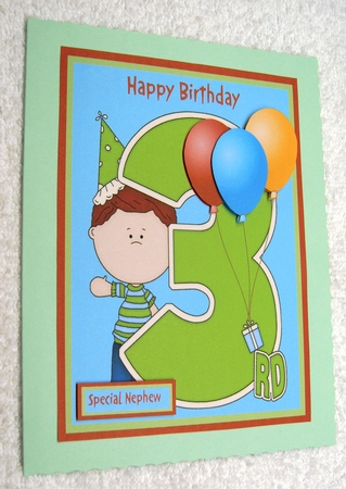Birthday card for boys with large number 3 and balloons by Margaret Scott