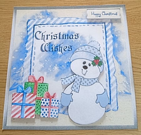 Presents for a snowman is a 7x7 card with decoupage by Margaret Scott
