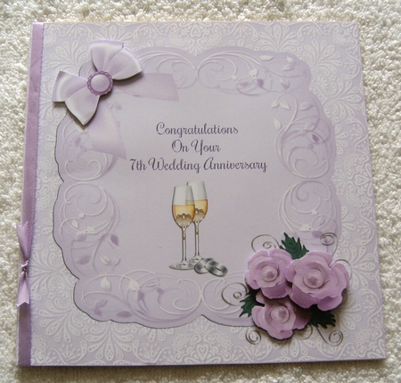 Champagne Glasses & Wedding Rings 7th Anniversary Card by Margaret Scott
