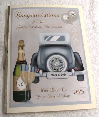 Golden Wedding Anniversary card front with wedding car, champagne & balloons by Margaret Scott
