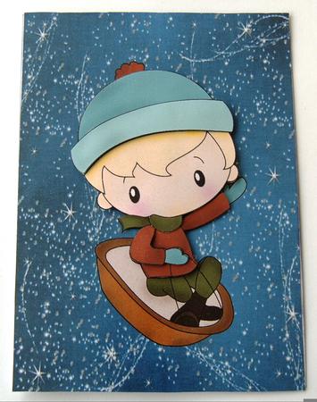 Little Boy on a Sledge with Blue Sparkle Backing Paper by Margaret Scott