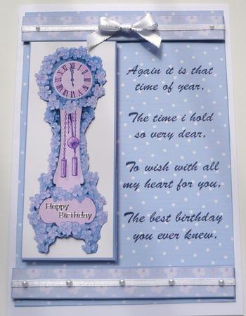 Blue Floral Clock Time of Year Birthday Card Front by Margaret Skinner