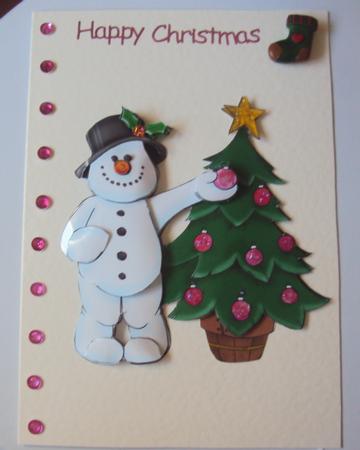 Frosty Doodles Decorating His Tree by Margaret Swaby