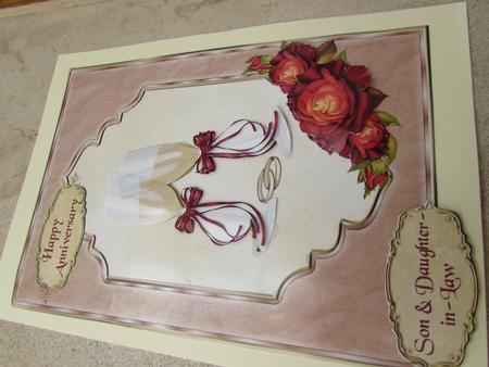 Anniversary Card with Champagne Glasses and Red Gold Roses by Margaret Swaby