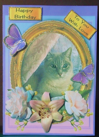 puss with flowers by Margarette Blakeborough