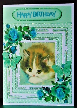 pretty kitten in polkadot frame with turq roses 8x8 by Margarette Blakeborough