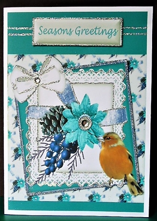 Lovely Robin With blue christmas arrangement and bow on lace 8x8 by Margarette Blakeborough