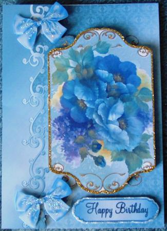 A Bouquet of Lilac/blue Flowers with Bows by Margarette Blakeborough