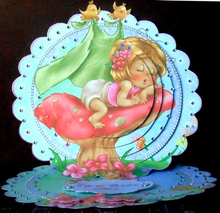 Baby Girl on a Toadstool Scalloped Round Easel Card by Margarette Blakeborough