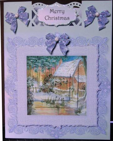 Snowy Winter Cottage with Lace Frame by Margarette Blakeborough