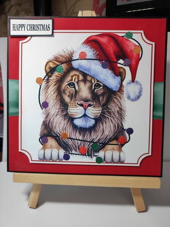 LION IN A SANTA HAT by marie nowell