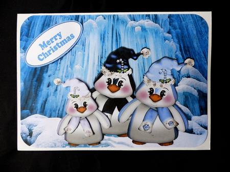 Penguin Family in the Antarctic with Hat and Scarf On by Maz Kfk