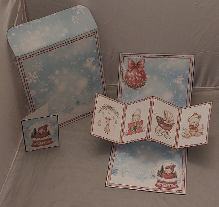 Babys First Christmas Snowglobe Twist & Pop Card by Marion Harding