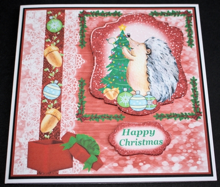 Hedgehog getting ready for Christmas card front by Marion Kimberley-Scott