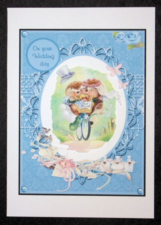 Wedding greeting card with bride and groom on bicycle by Marion Kimberley-Scott
