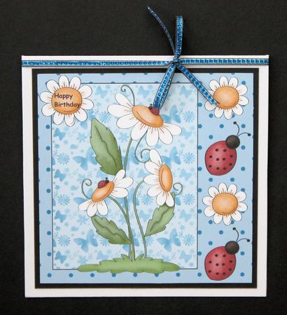 Blue Ladybird and Daisy Card Front by Marion Kimberley-Scott
