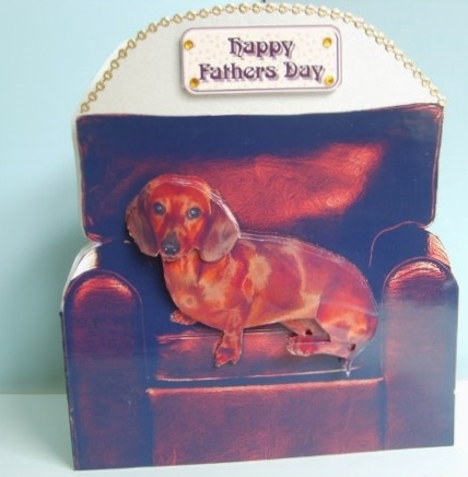 Dachshund in an Arm Chair by Marion MacKellar