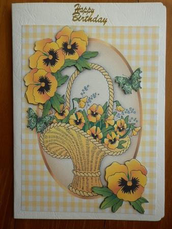 Basket of Yellow Pansies in Oval Frame A4 by Marion West
