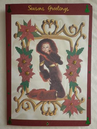 Wrapped for Winter in Fur and Poinsettia Frame A4 by Marion West