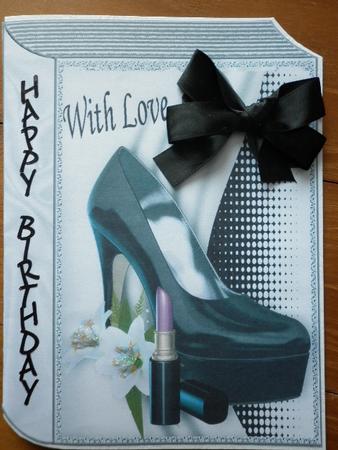 Black Shoe with Lipstick on Folded Book by Marion West