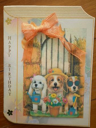 Trio of Gardening Pooches on a Folded Book by Marion West
