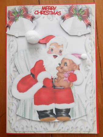 Santa Sitting in a Chair, with Ornate Bells by Marion West