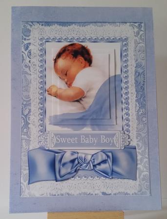 Sweet Baby Boy, with Satin Bow and Lace Pyramids by Mary Brunton