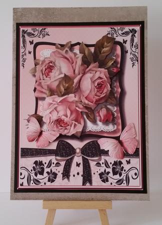 Lovely Roses on a Black and Pink Bracket  by Mary Brunton