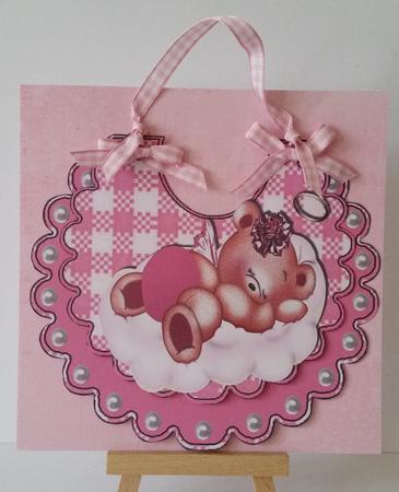 Sleepy Little Angel Bear in Pink on a Cloud, on Bib by Mary Brunton