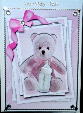Cute pink teddy with bottle on stackers with pink bow by Mary Murphy