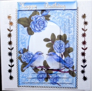 Pretty purple roses on a branch with purple birds pyramids by Mary Murphy